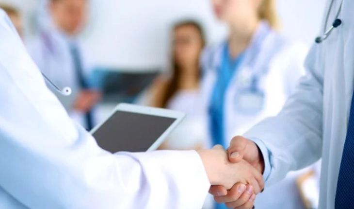 Image of a medical facility team using a tablet device