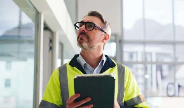 image of a facility manager on site using a tablet device
