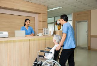 image of aged care staff at a reception area desk, inside an aged care facility