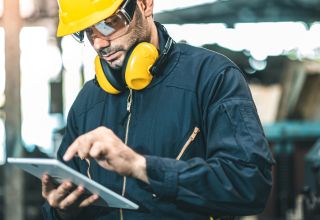 image of a maintenance contractor using a tablet device