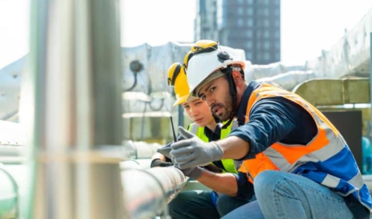 image of two tradespeople completing a work order on a facility site