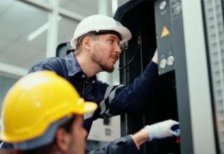image of two technicians carrying out a maintenance work order
