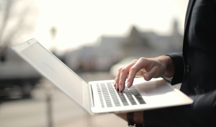 image of a facility manager using a laptop device