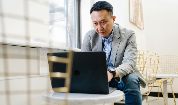 image of a facility manager using a laptop device