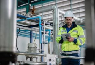 image of a facility site contractor checking a site asset