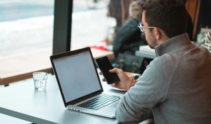 image of a facility asset manager using a laptop device