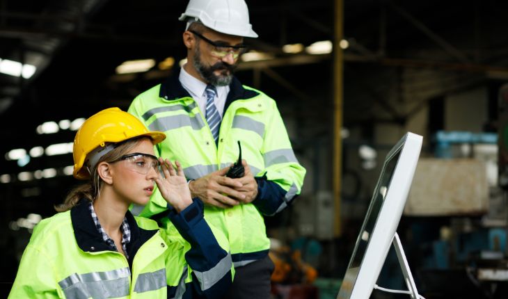 image of two facility managers using a computer