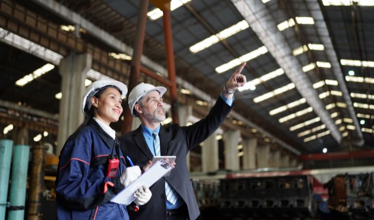 image of two facility staff surveying a site interior