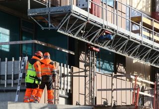 image of two trades workers at a facility site
