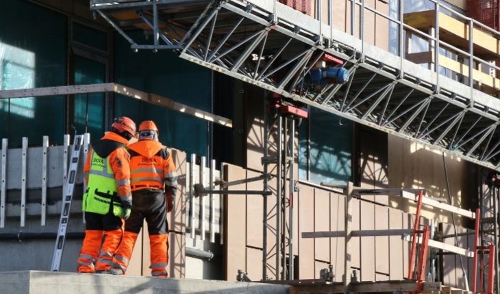 image of two trades workers at a facility site