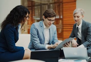 image of three facility managers in conversation