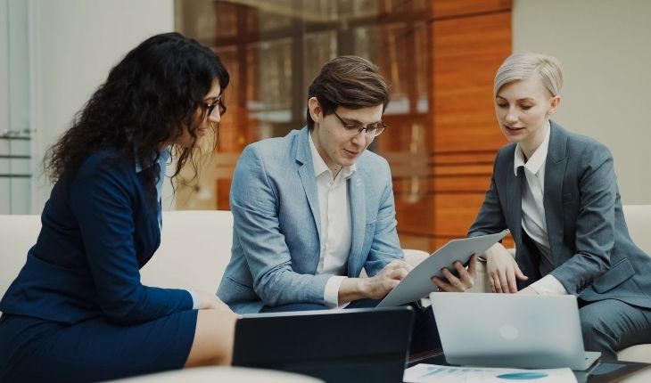 image of three facility managers in conversation