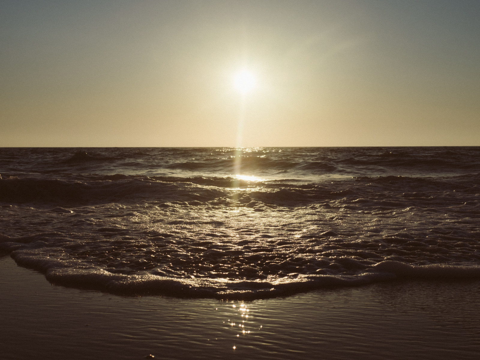 Sunlight falling on the ocean waves.