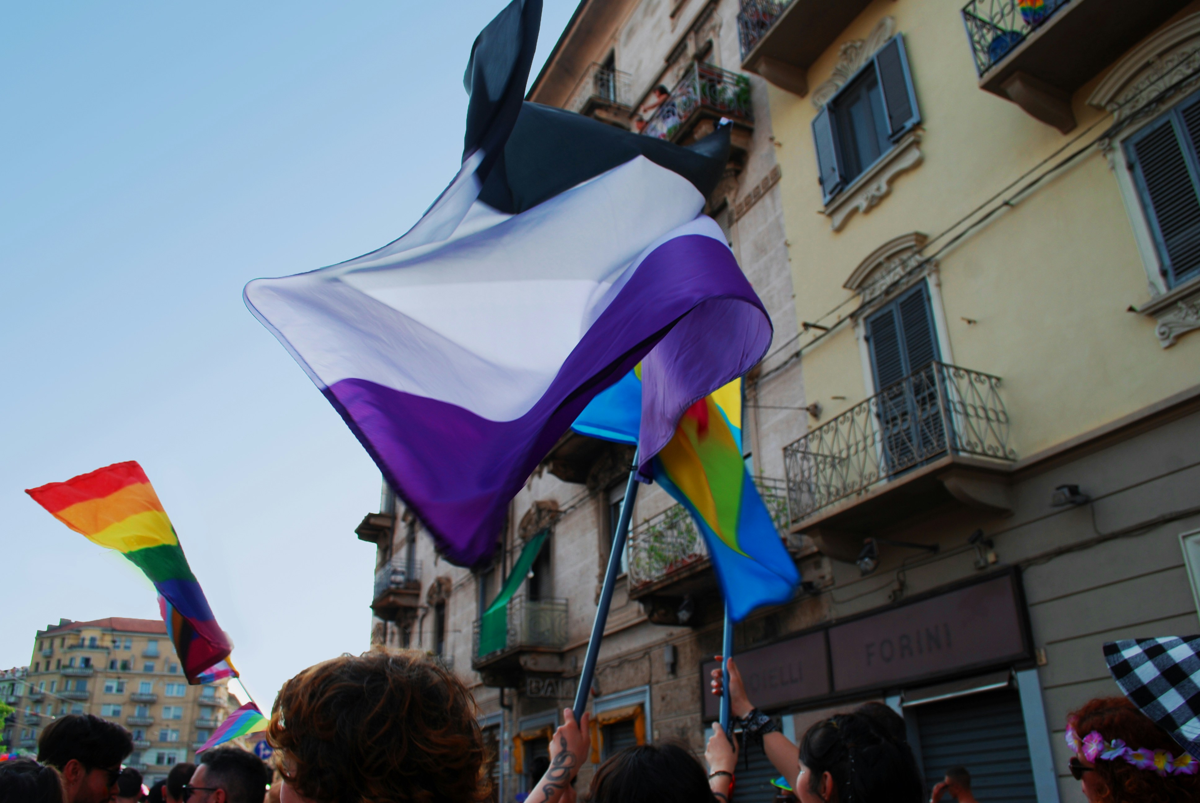 The asexual flag waving at a Pride parade.
