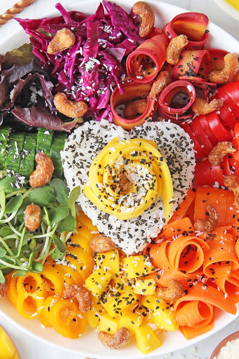 Close-up of the Spicy Mango Rice Bowl recipe topped with cashews and shredded coconut.
