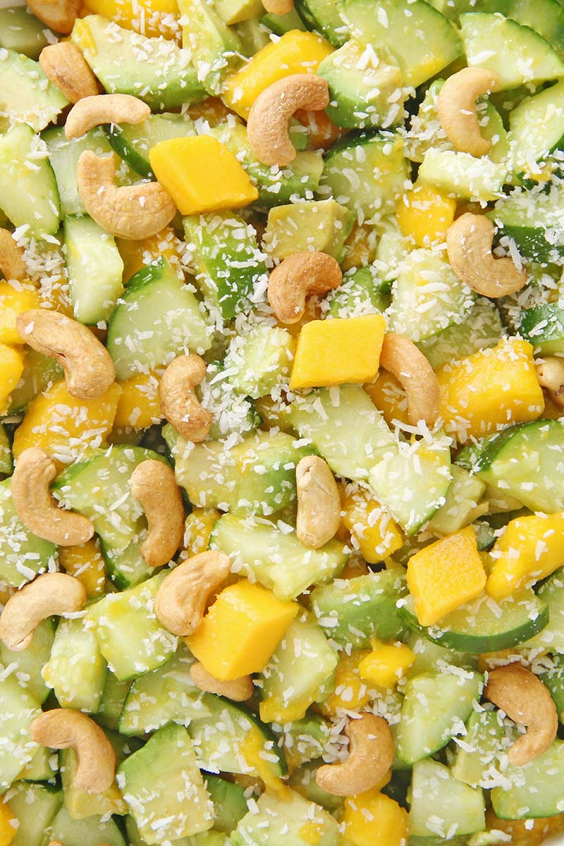 Close up of Mango Cucumber Avocado Salad, showing the colorful, fresh, and healthy ingredients.