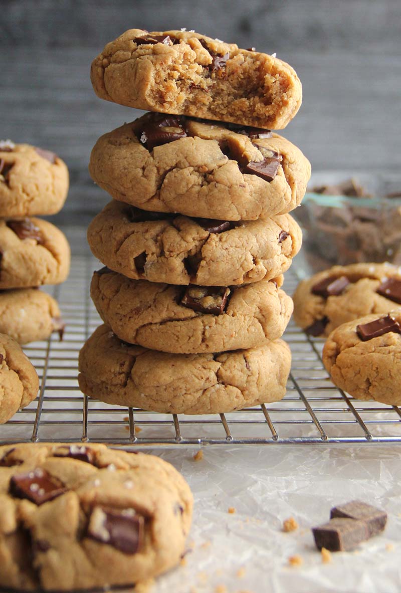 Close-up of a vegan gluten-free peanut butter chocolate chunk cookies, showing the soft texture and melted chocolate chunks.