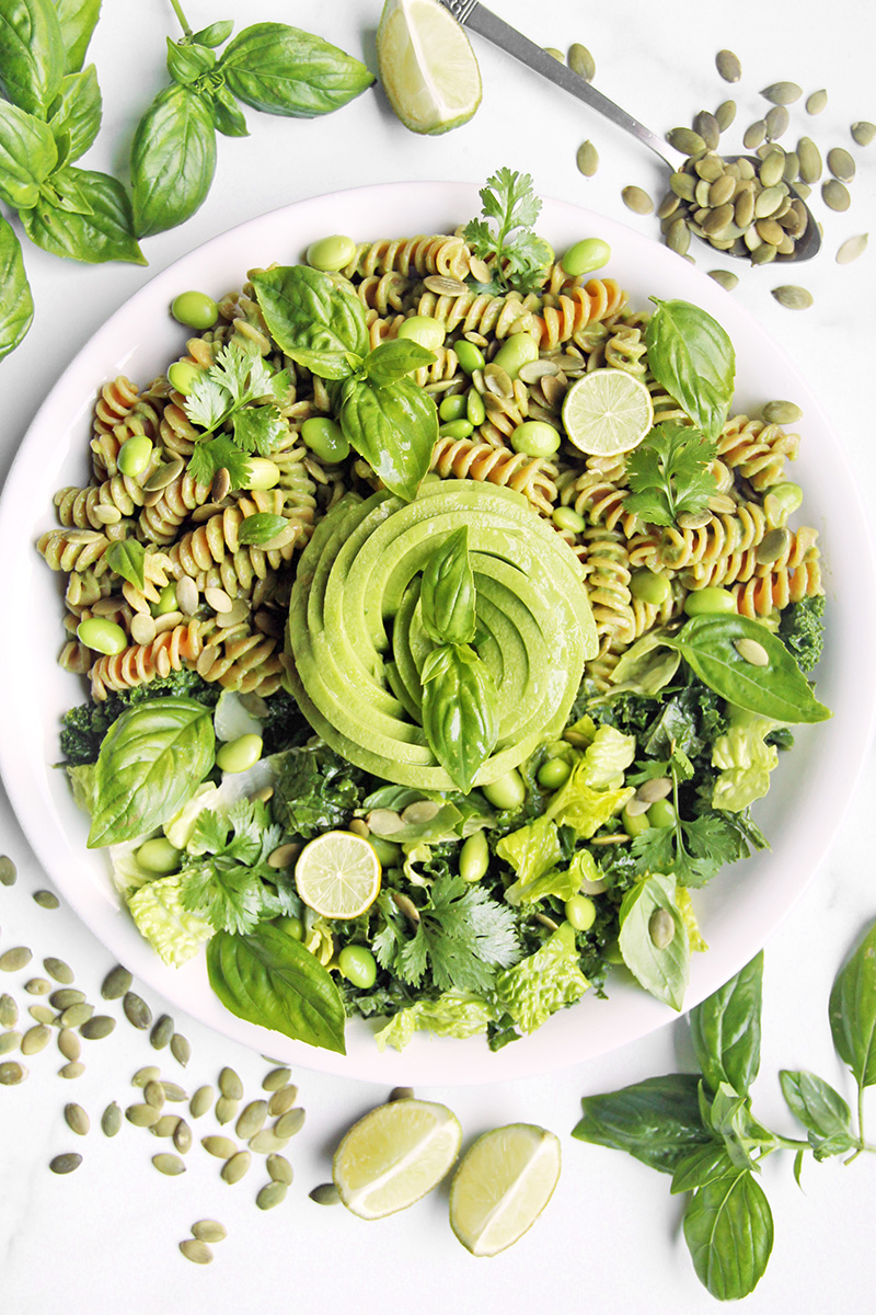 A vibrant healthy salad dressing recipe using creamy avocado, shown over a green bowl meal