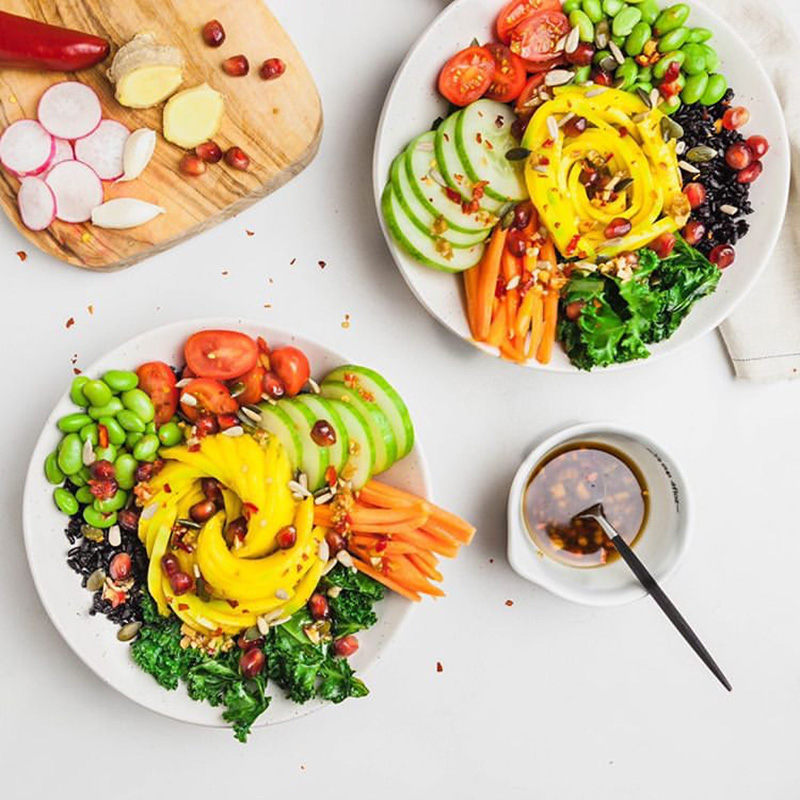 Plant based salad dressing recipe on a salad with Asian flavors