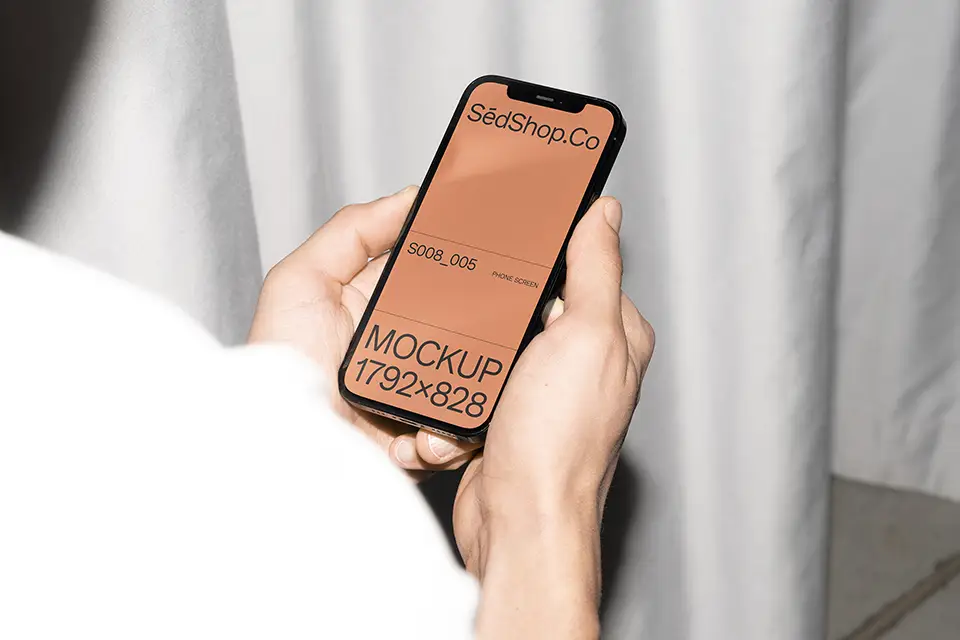 iPhone Mockup held in both hands with bright lighting and minimalist background.