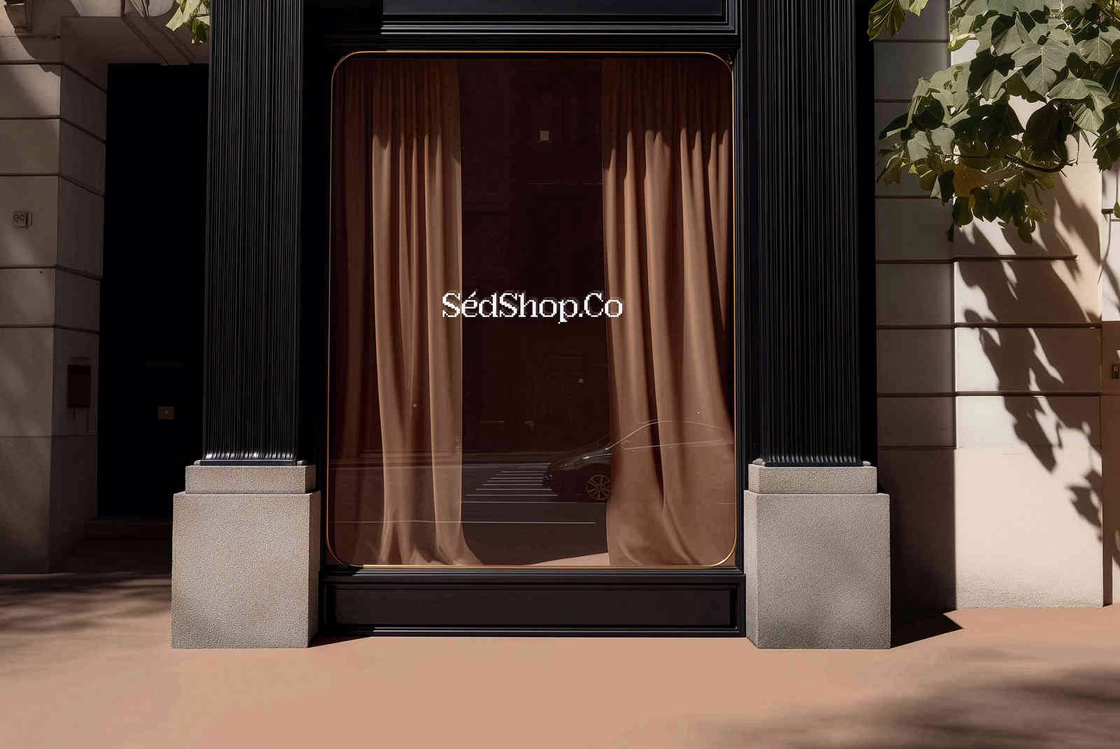 A storefront entrance with a curtain and the SedShop.Co logo on the glass in soft daylight.