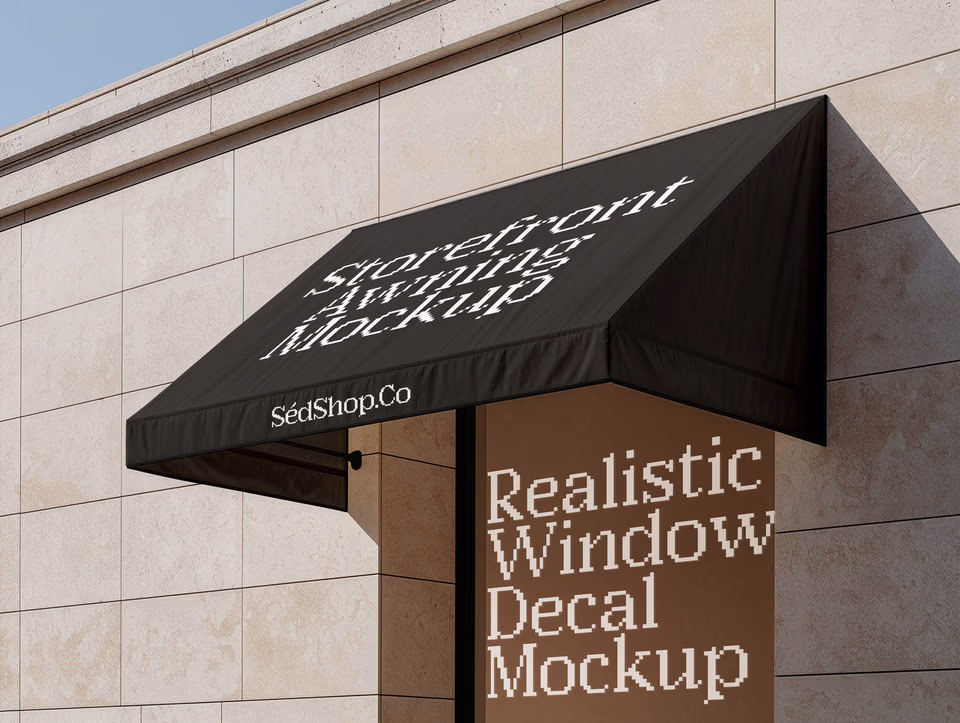 A fabric storefront awning with the SedShop.Co logo above a stone building facade in daylight.