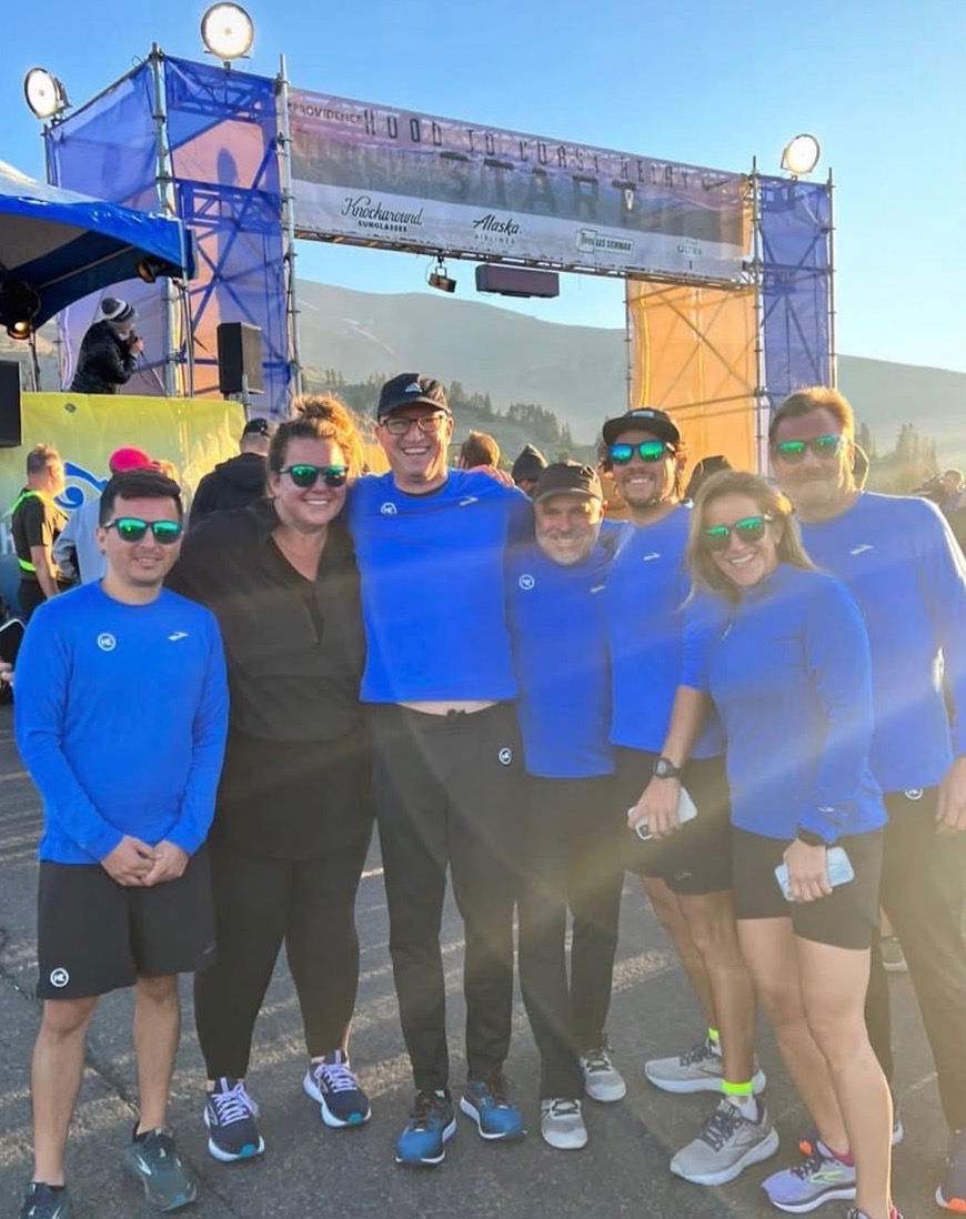 Suzanne Berg Currier poses with Knockaround colleagues