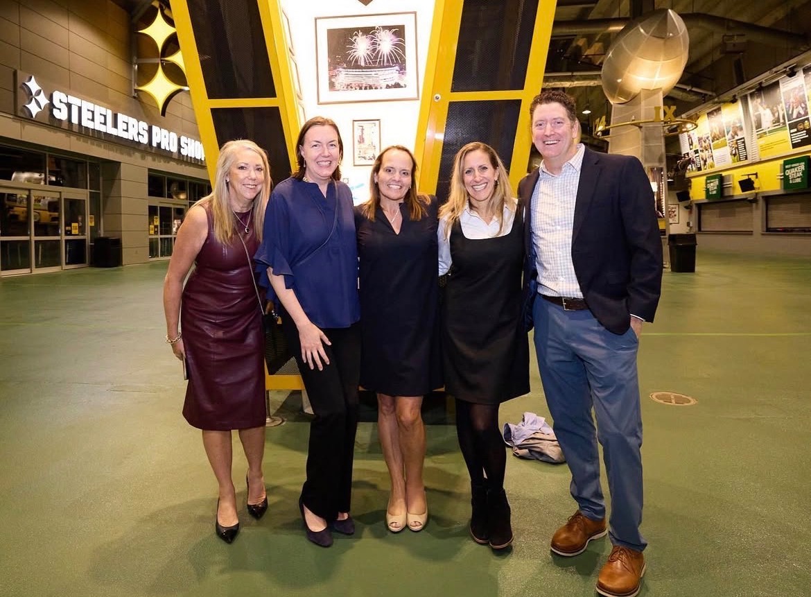 Suzanne Currier of the Woodside Leadership team at a professional event at Heinz Field