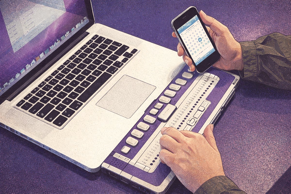 A modern laptop and braille tool on a wooden desk, showcasing its keyboard and screen.