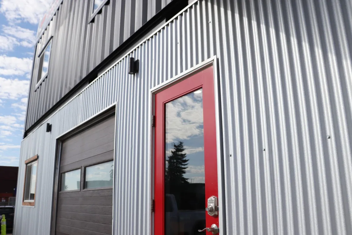 office shipping container conversion with glass door and garage