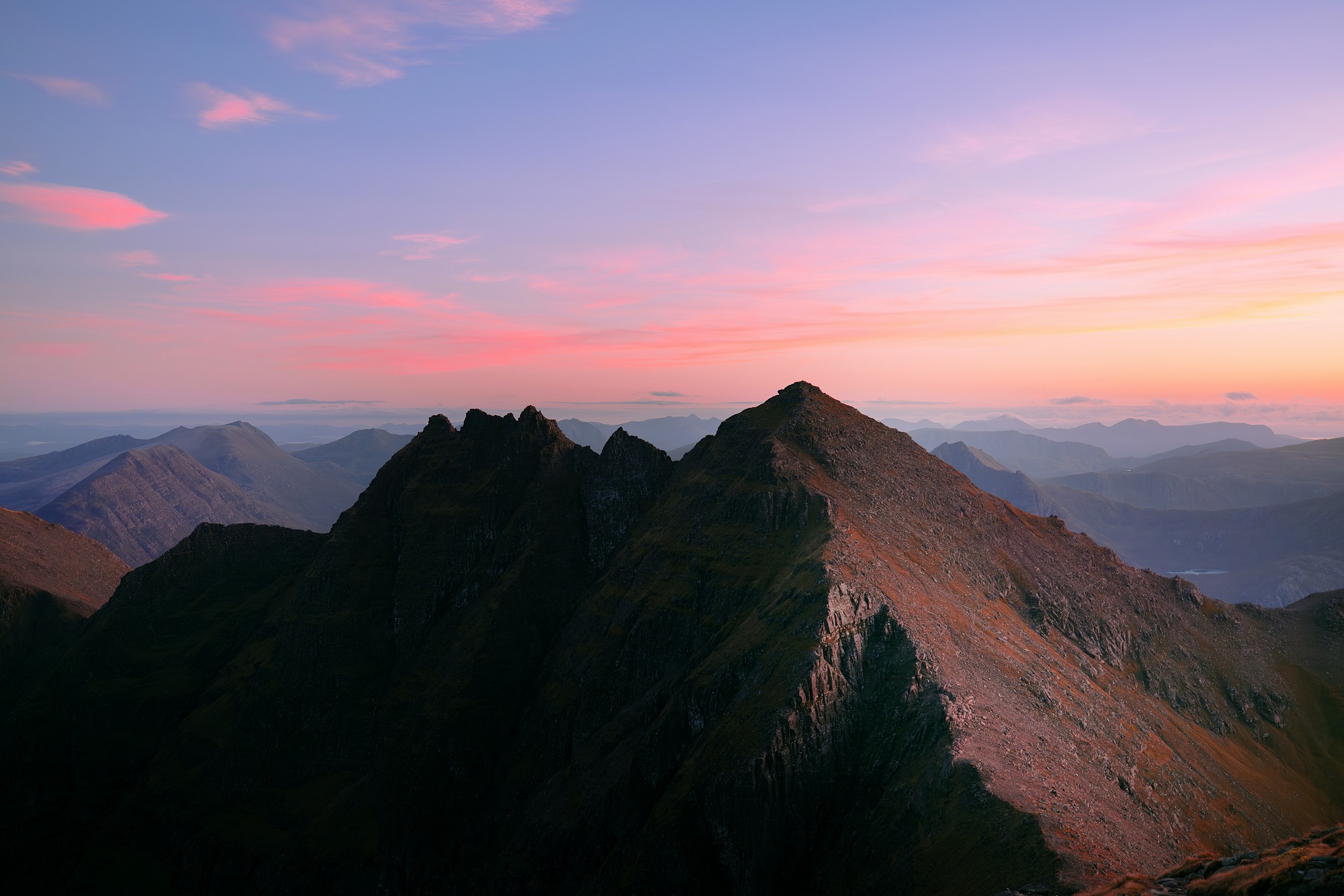 Mountains with pink and purple sunset sky