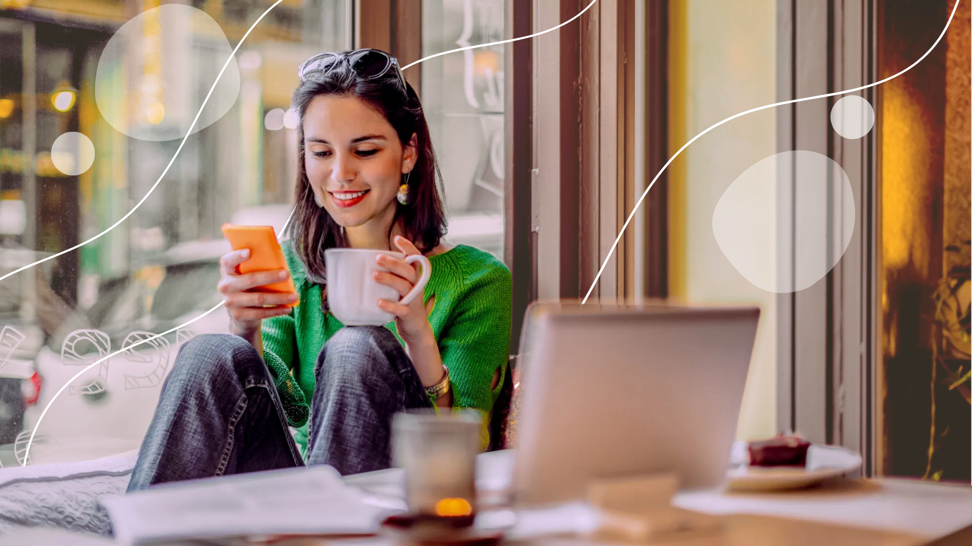 Happy woman on computer with overlaying image of phone showing home screen of cabana app