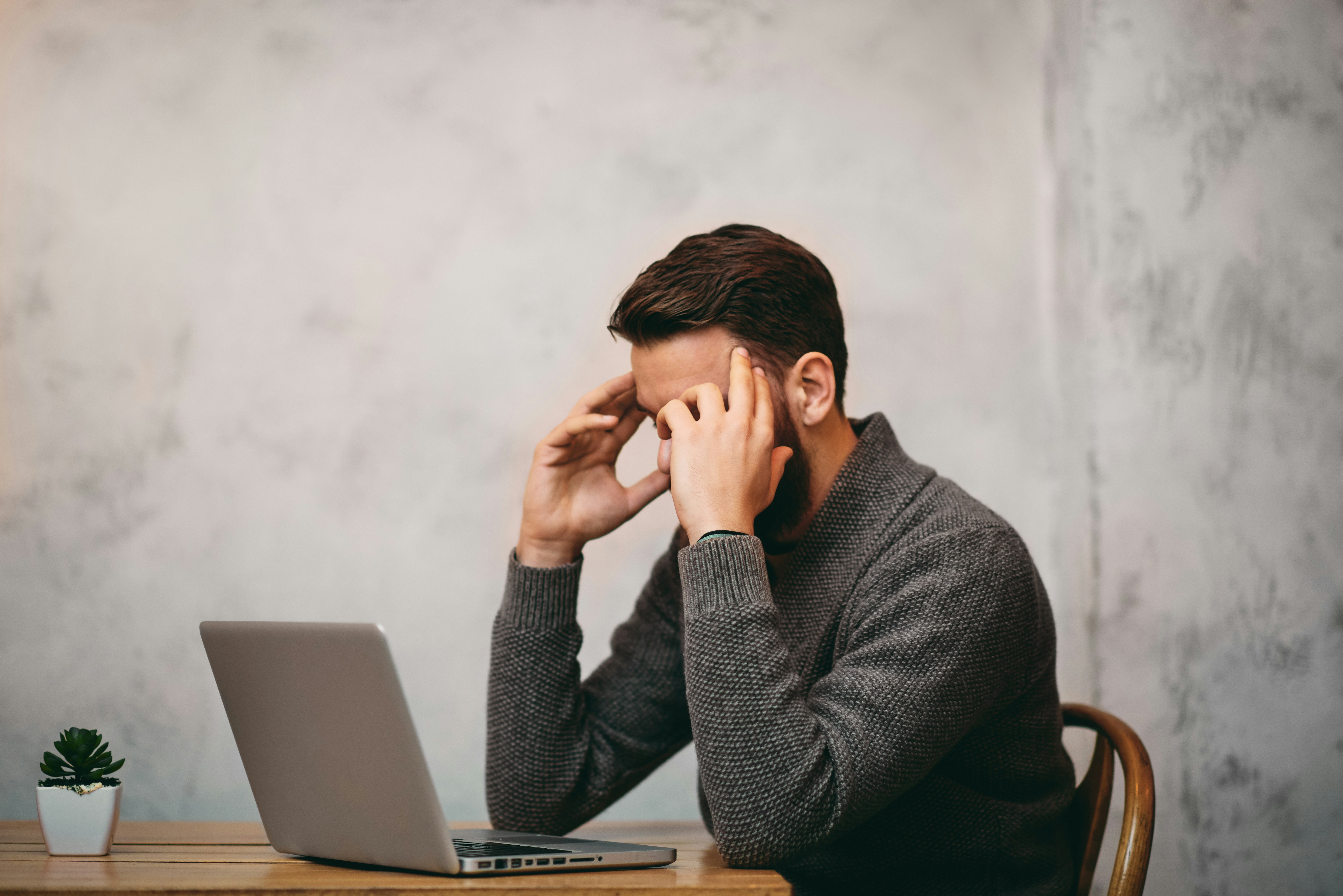 Woman stressed at her work desk