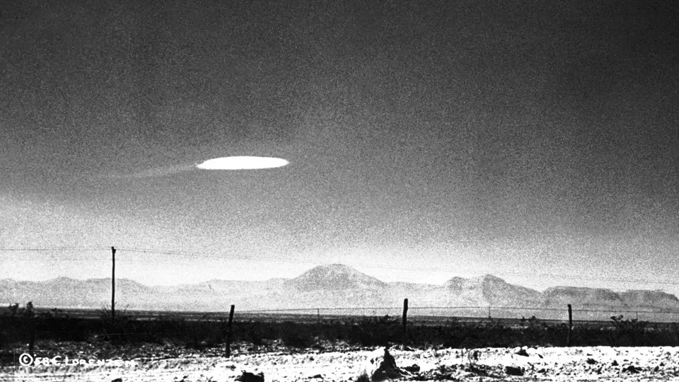A photo of a UFO-shaped object in the sky