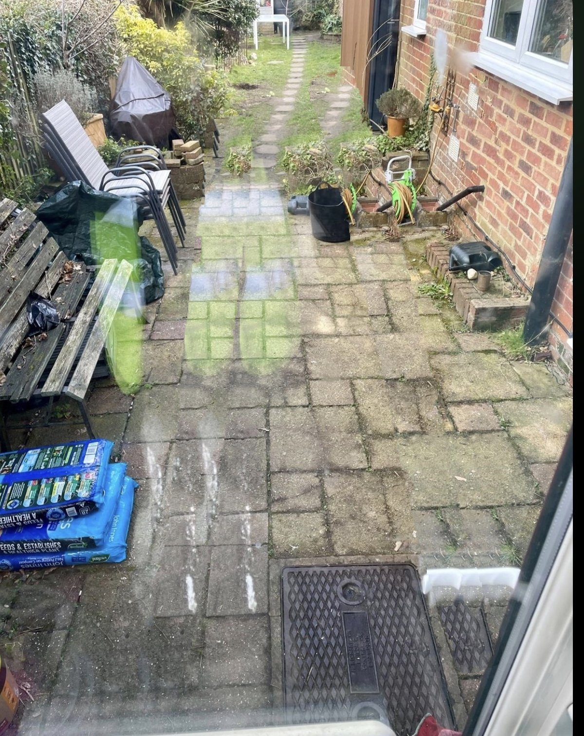 Before: the existing patio and side passage over the extension footprint, Farnham GU9