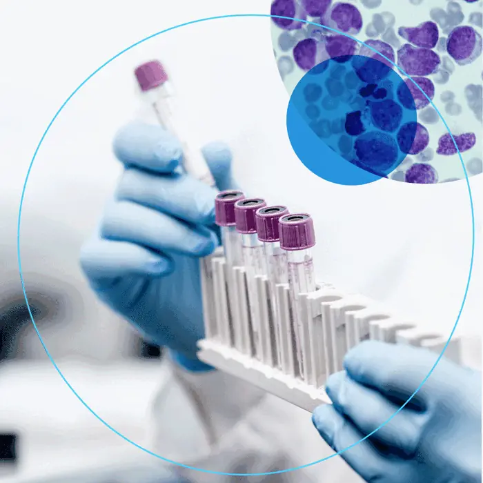 Labcorp Discovery social post: gloved hands holding a rack of test tubes