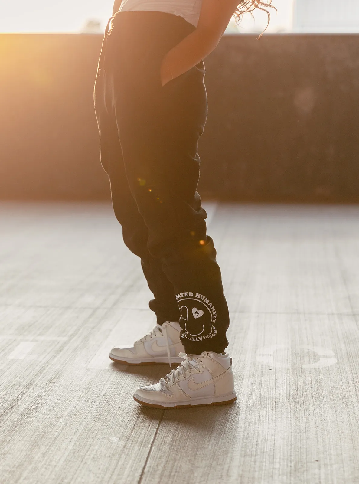A model wearing the Love Heals Sweatpant product.