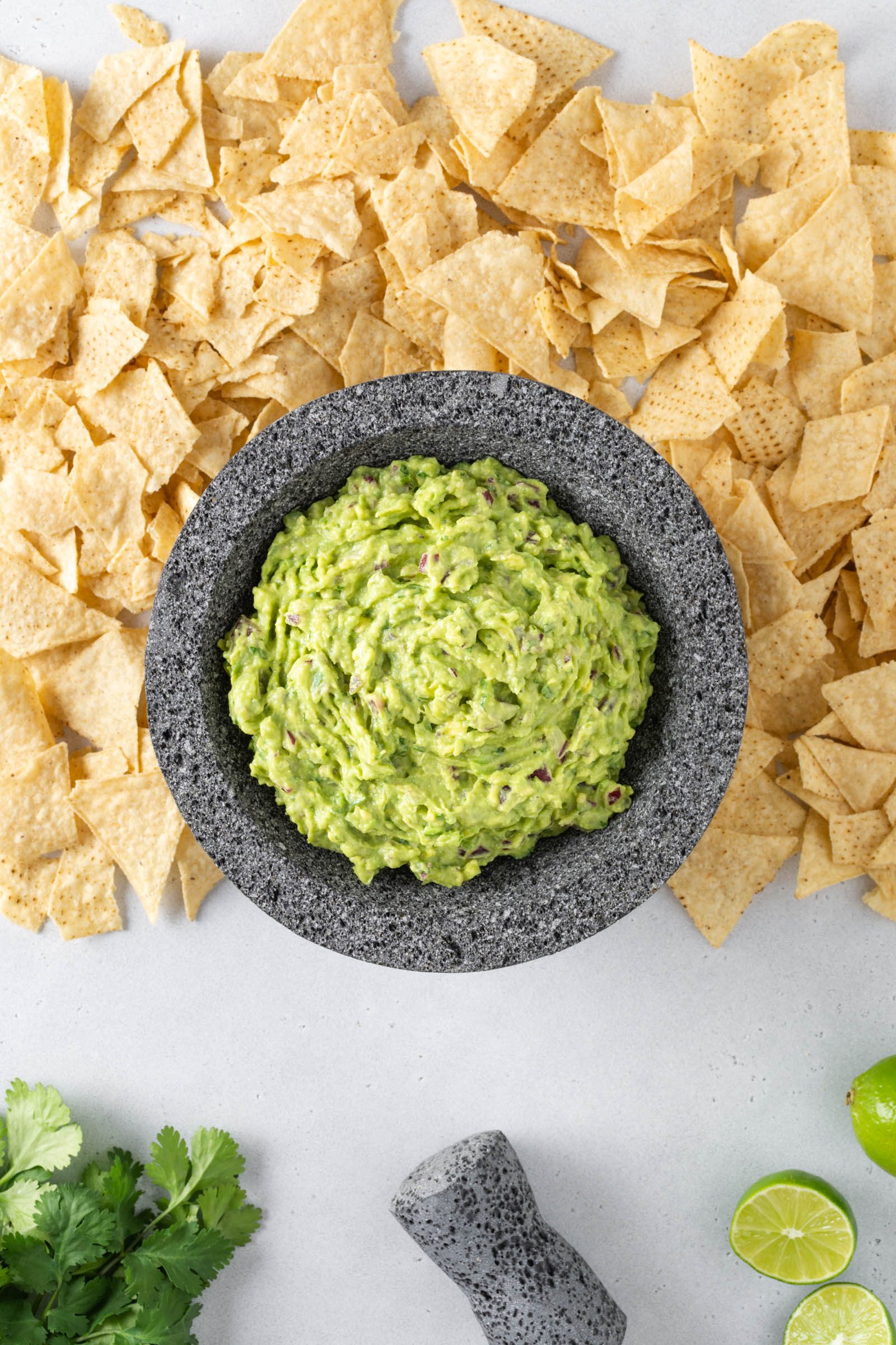 Overhead view of guacamole with tortilla chips.
