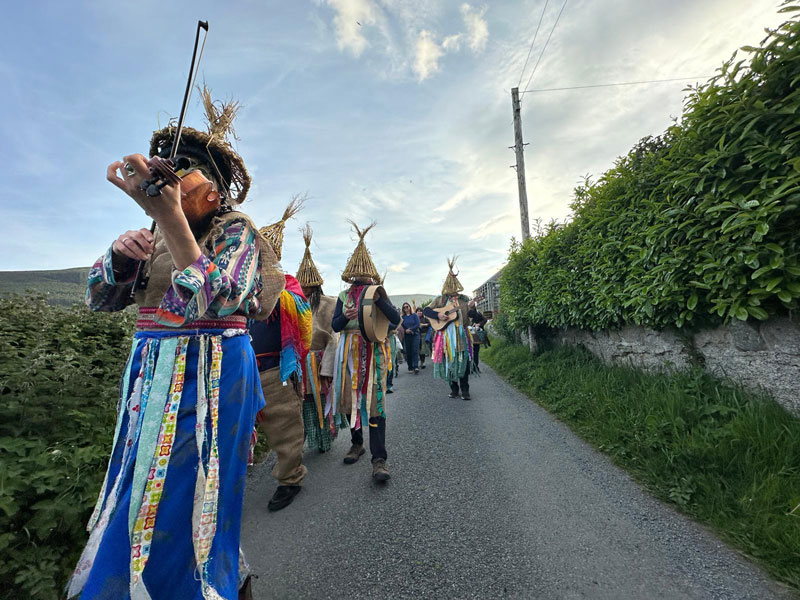 wren boys playing music and parading