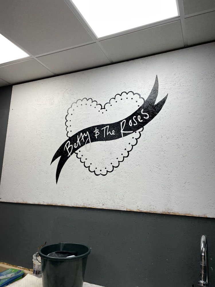 adamdoesdesign betty and the roses hand painted sign writing wall mural logo 1
