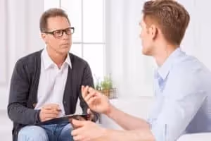 man interviewing man