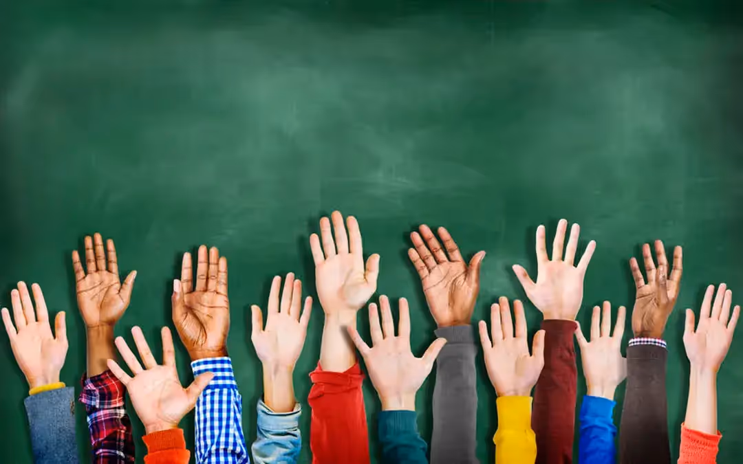 Image of many peoples' hands raised in the air - UserVoice Images 