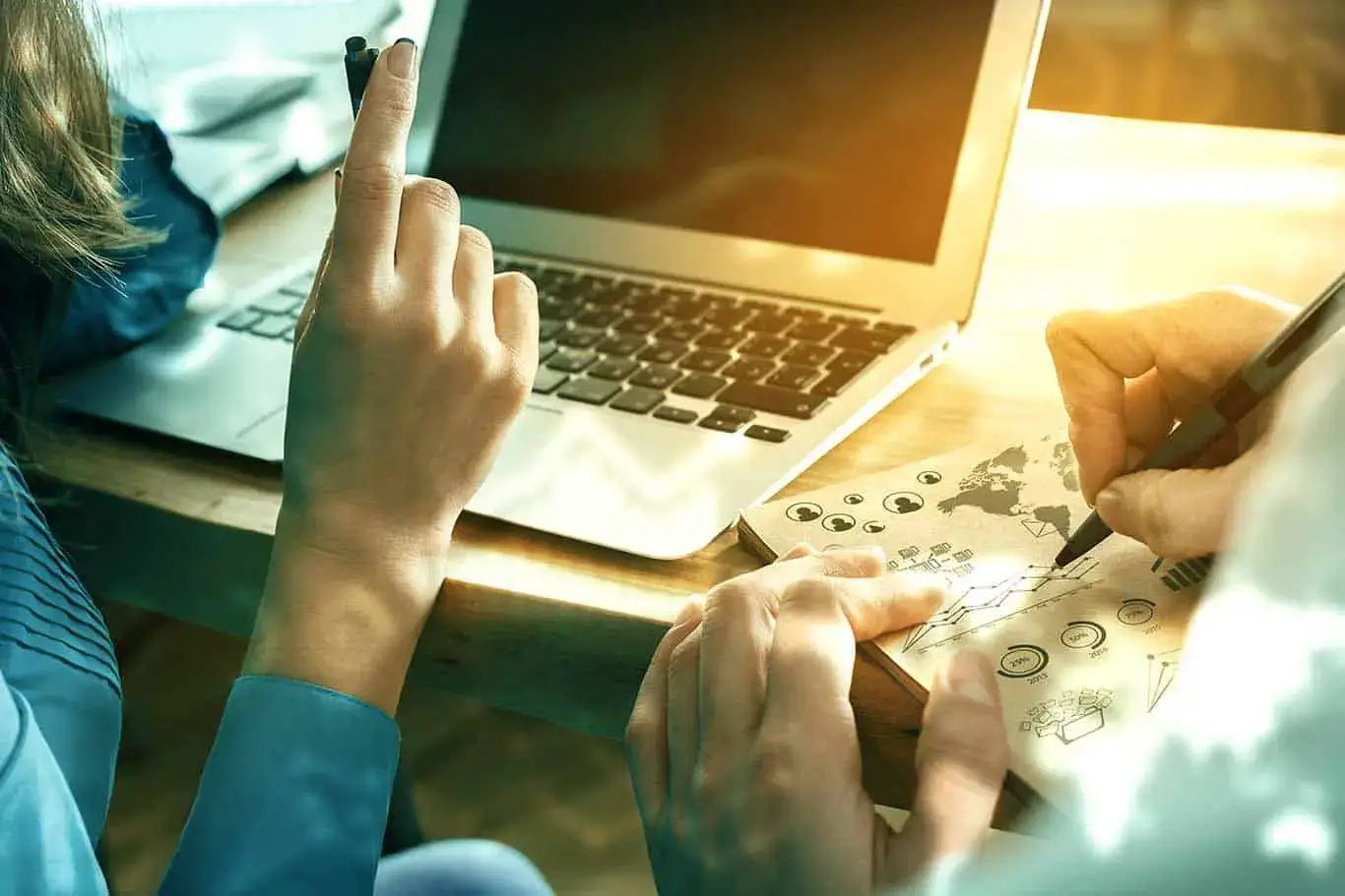A person is writing on a piece of paper. - UserVoice Images