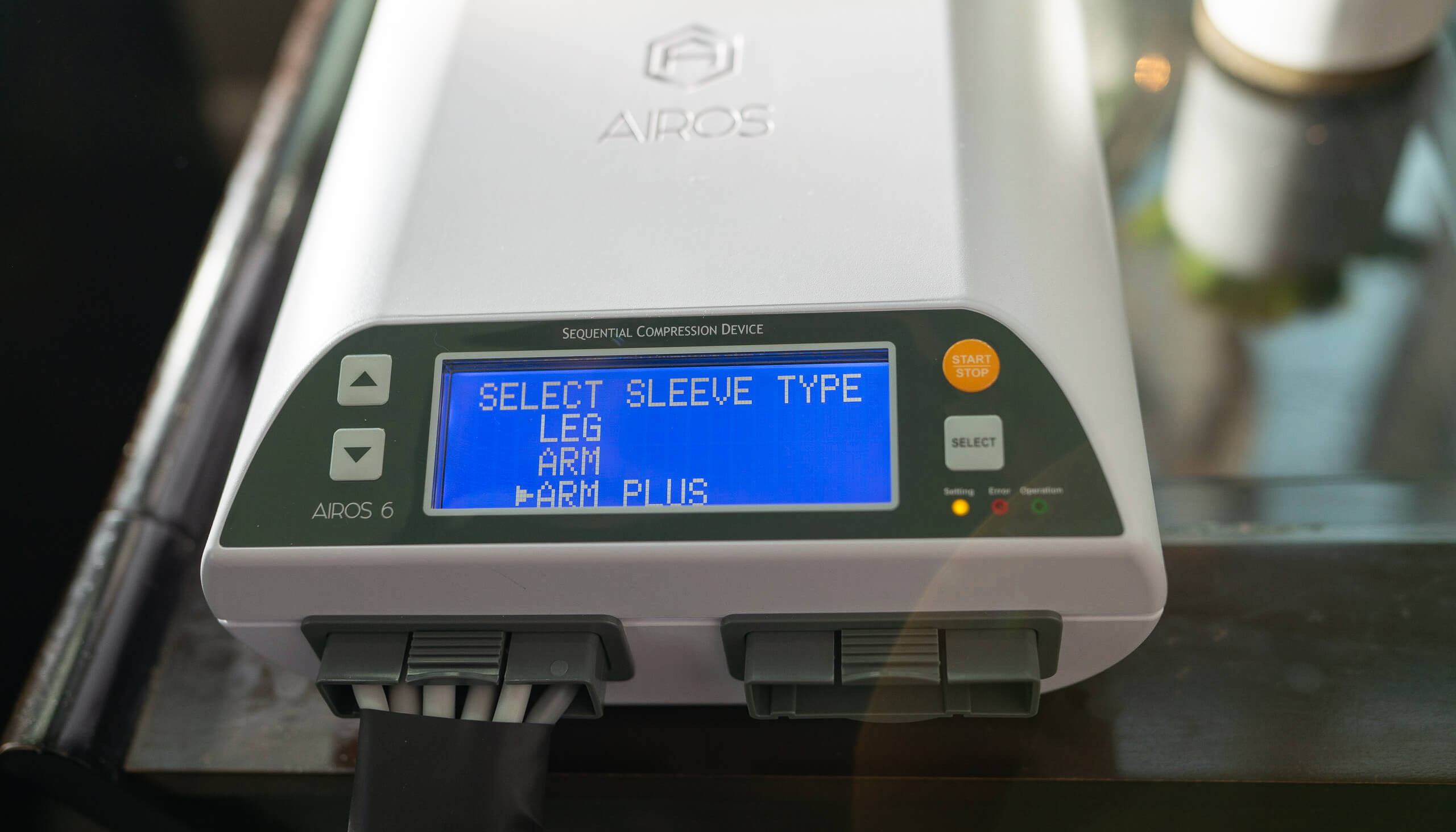 Machine with a blue screen detailing the pressure applied by the sleeve and button to control it