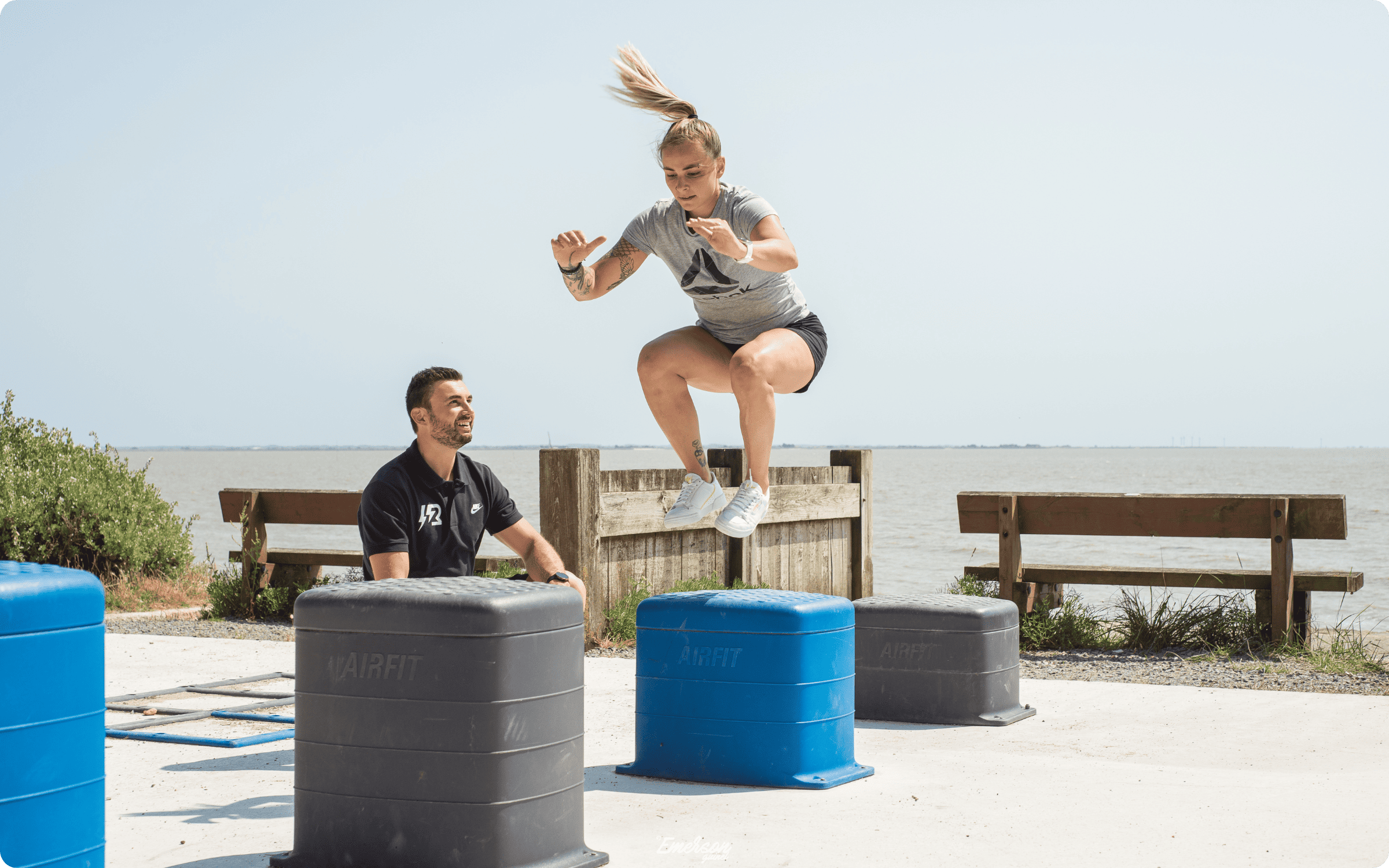 Before and after images of an outdoor grassy area in Lizy-sur-Ourcq, showing a plain lawn before and a 3D integration of a fitness park with exercise equipment added on a paved section.