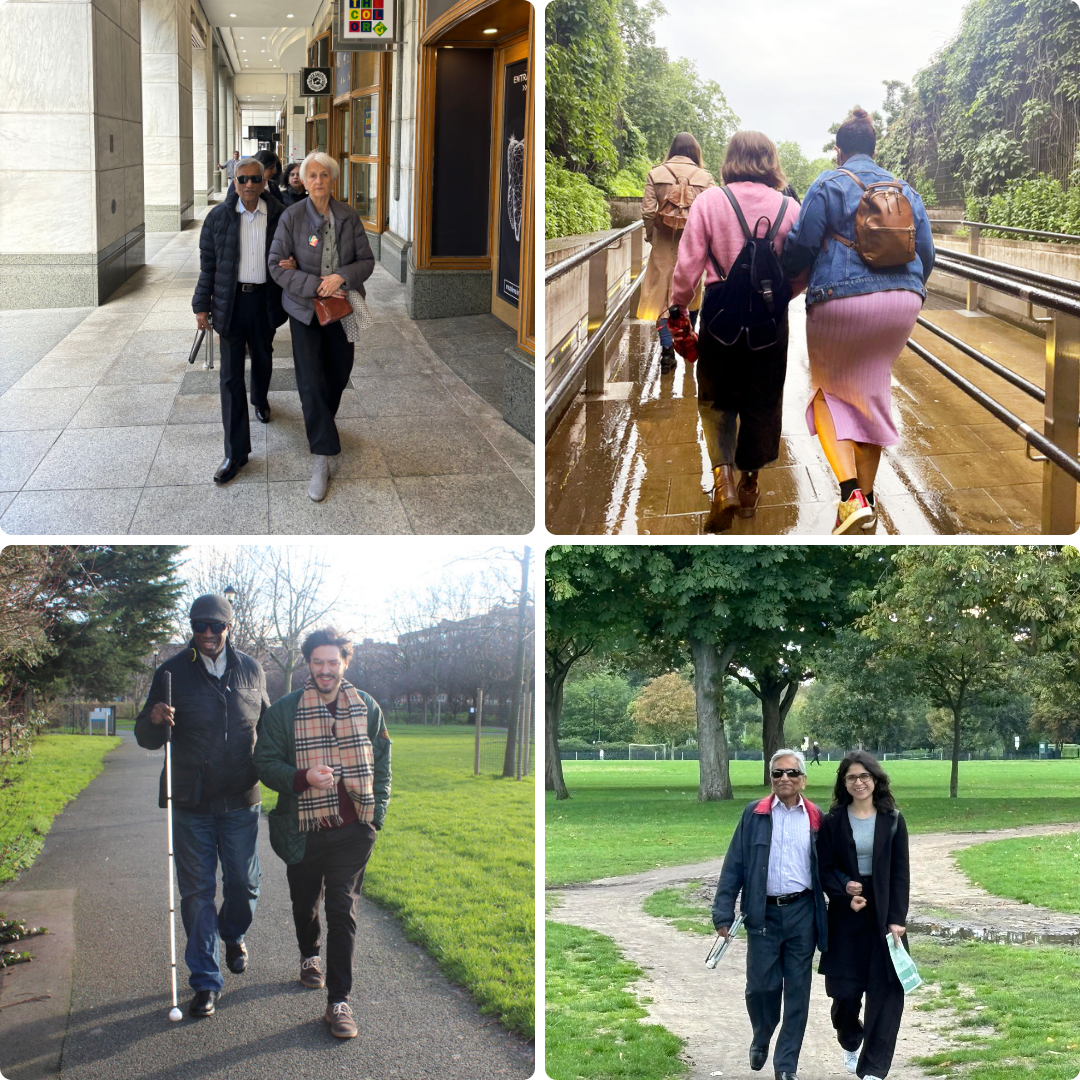 A collage of four images showing people walking side by side, some assisting visually impaired individuals. Top left: a man wearing sunglasses walks with a woman through an indoor corridor. Top right: three people walk outdoors on a wet path surrounded by greenery. Bottom left: a man using a white cane walks with another man in a park. Bottom right: a man holding a white cane walks with a smiling woman through a park.