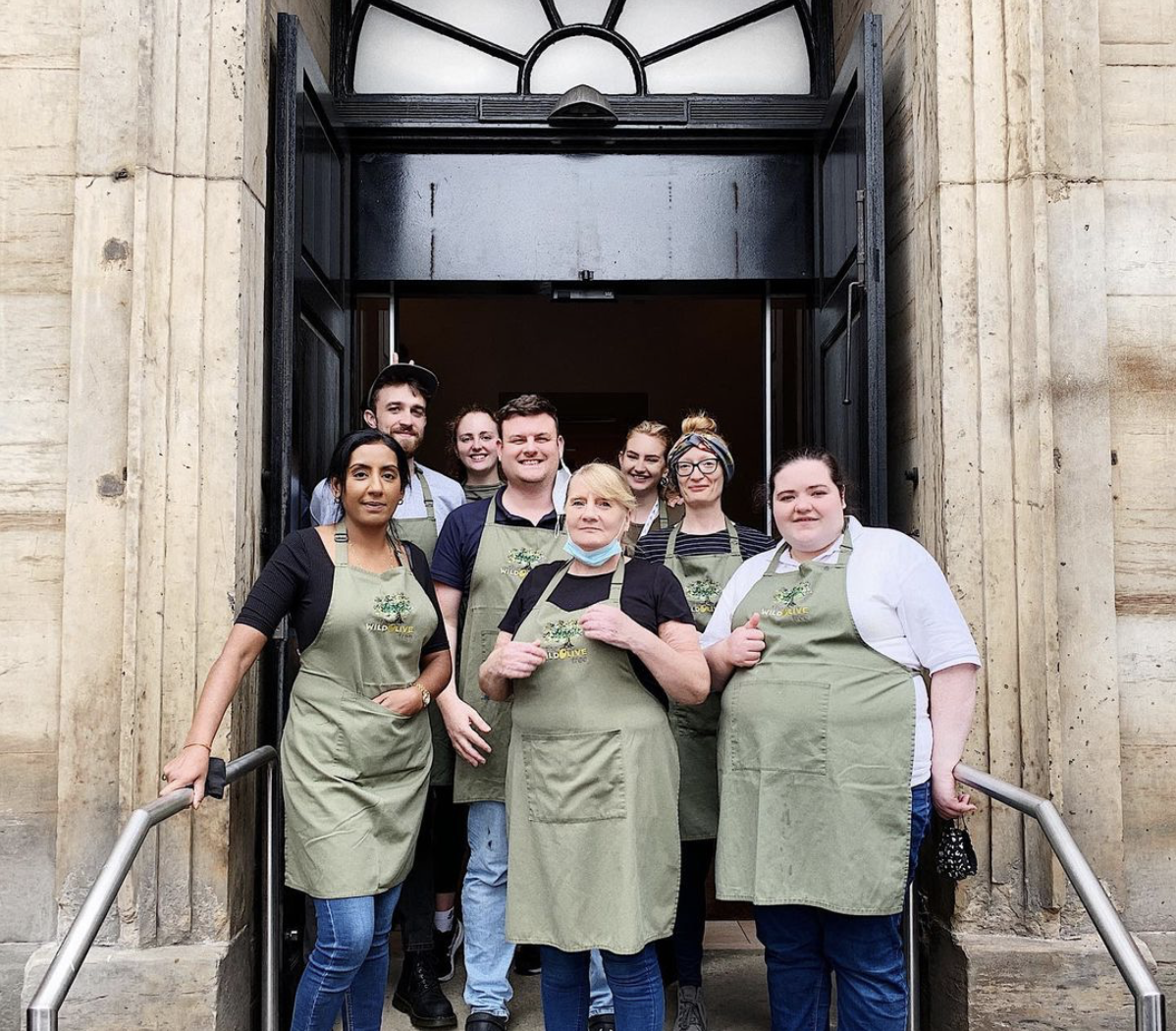 Staff standing in the front entrance