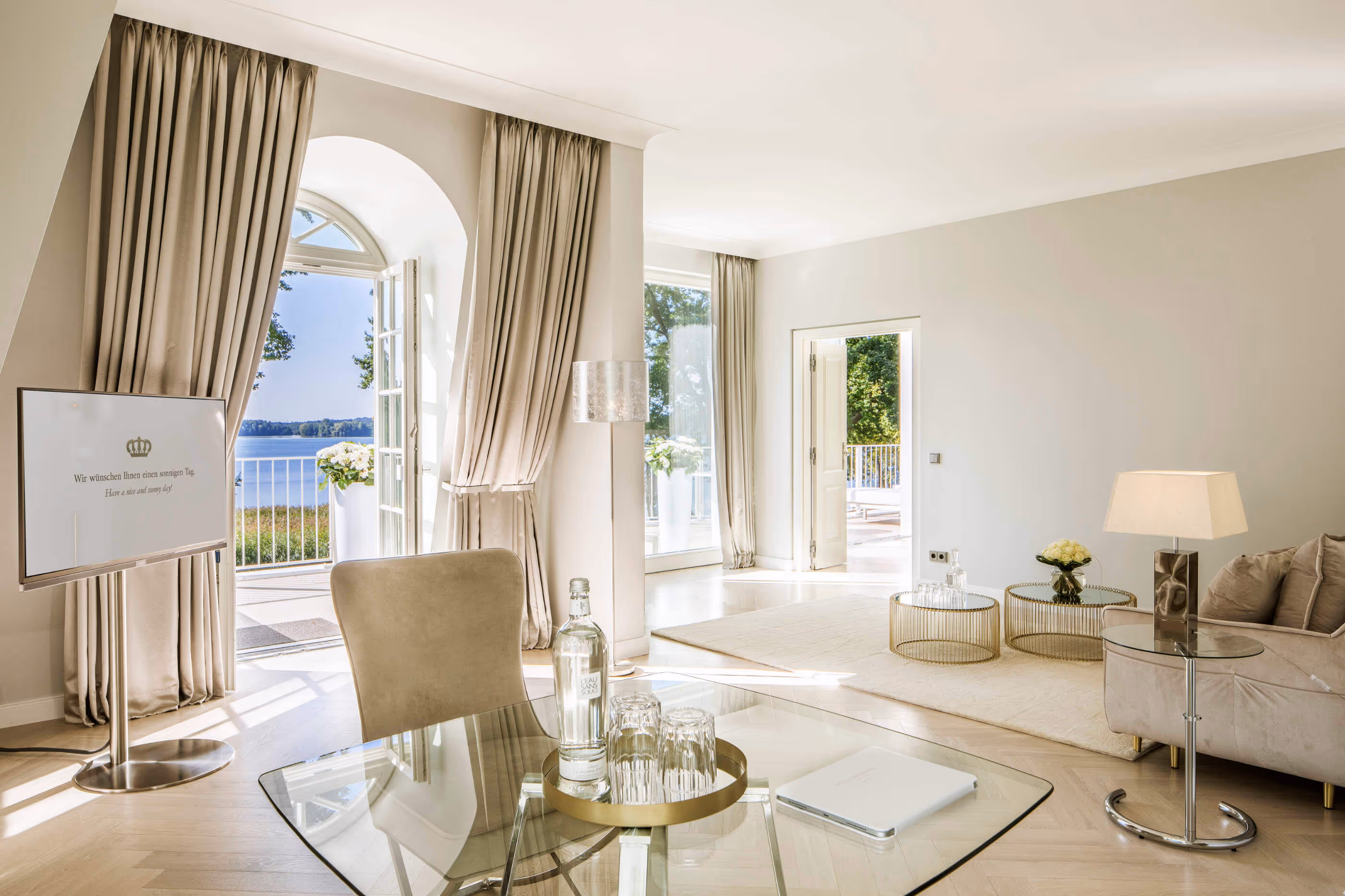 Lounge of the Grand Suite in the Luxury Hotel & Spa Resort Villa Contessa - with a wonderful view of lake Scharmützelsee and the Bad Saarow lakeside promenade