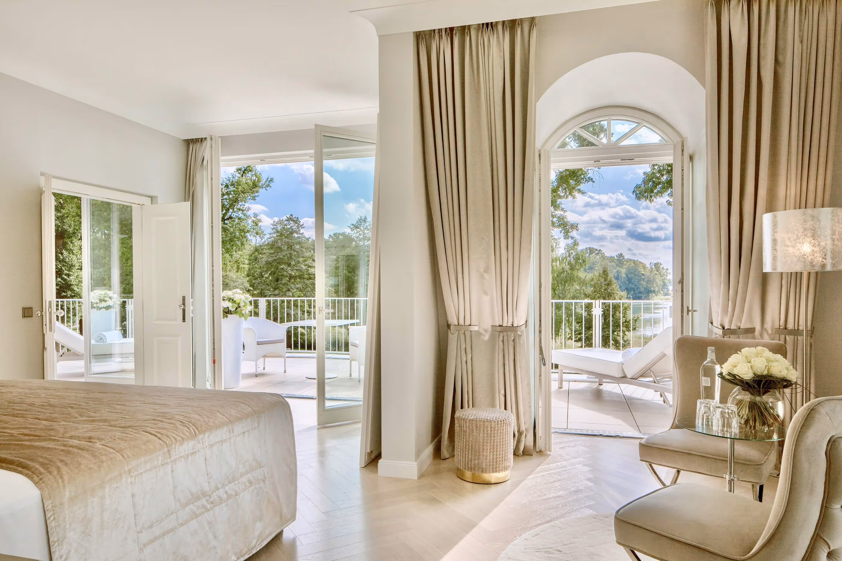 Bedroom of the Grand Suite with a wonderful view of lake Scharmützelsee and the Bad Saarow lakeside promenade - Luxury Hotel & Spa Resort Villa Contessa