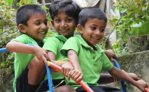 Children playing on a slide.
